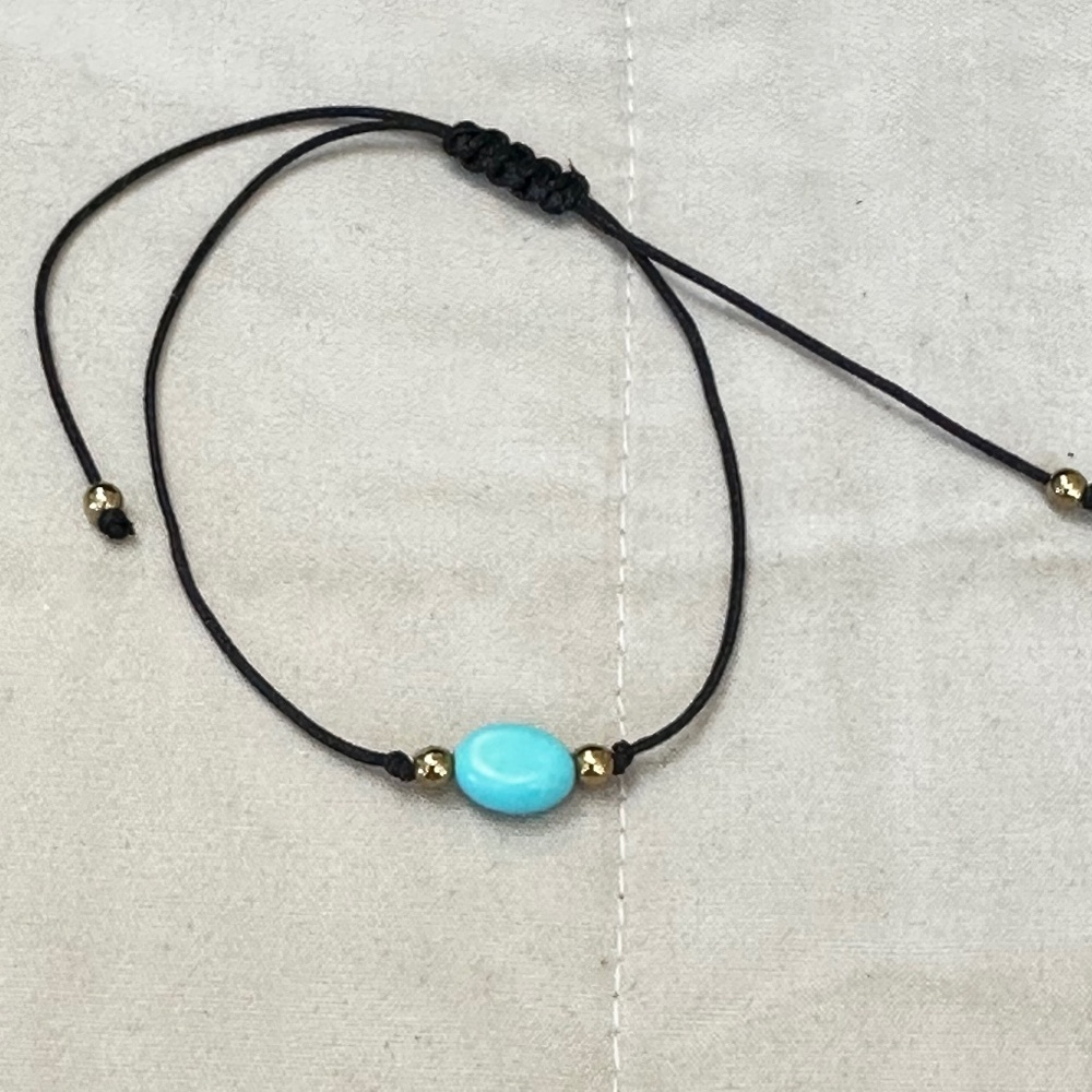 Howlite dyed blue & gold bead bracelet on black cord, adjustable.